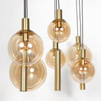 Suspension multiple en verre ambré et laiton à 9 ampoules – 150x55 cm