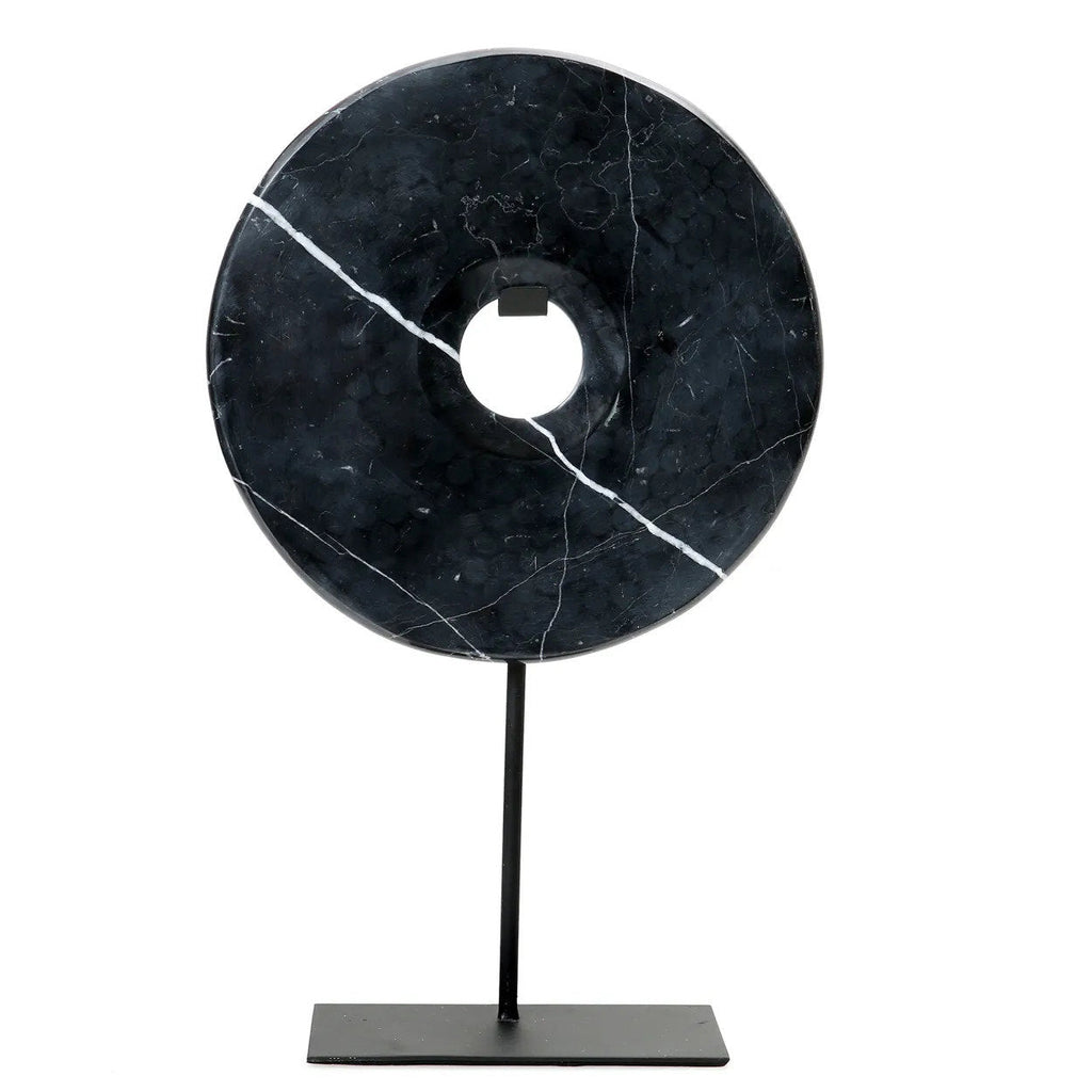Disque décoratif en marbre noir sur socle métallique