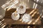 Dessous de verre rond en herbe marine et coquillages Ø12 cm