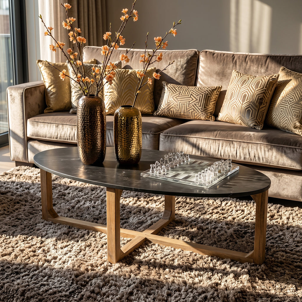 Table basse ovale en marbre noir et bois clair croisé – 120x60 cm