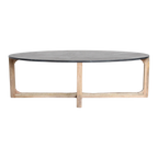Table basse ovale en marbre noir et bois clair croisé – 120x60 cm