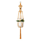 Support de plante en macramé orange avec plante en pot suspendue décoration intérieure