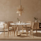 Suspension en rotin naturel ajouré forme fleur Ø65 cm au-dessus table