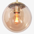 Suspension en verre ambre sphère avec cadre en métal doré Ø25 cm