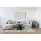 Canapé sectionnel beige aux contours arrondis et coussins moelleux en polyester sable 160x230 cm