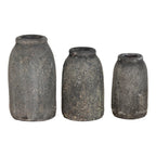 Trois vases en céramique effet pierre gris foncé avec surfaces texturées